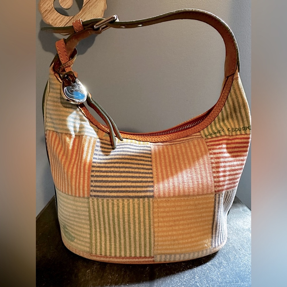 Authentic Dooney & Bourke multi-colored striped  bucket purse. Just needs TLC
